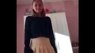 Teen in skirt teases and strips